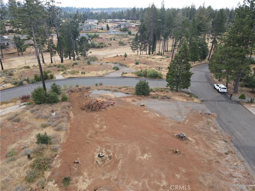 Wonderful Magalia Location for this .25 acre lot. The lot is very close to the school, grocery store, gas station, frisbee Golf Course and Izzy's restaurant. This is a great Corner Lot that is nice and level. The home that was lost was a 2-bedroom 2 bath home with 1,440 square feet. This property is located in the Paradise Pines Owners Association, only 310.00 FOR THE YEAR. The association offers a pool, spa, tennis courts, Bocco ball, meeting halls, playground, bar, billiards, basketball area, pickle ball, walking trails and banquet building. Every Saturday they have entertainment and are constantly putting on events for the residents. They also maintain wonderful hiking trails into the canyons and down to creeks/streams. Excellent place to call home.
