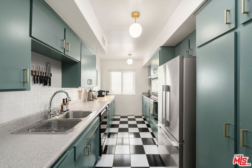 Top-Floor beautifully remodeled and spacious 1bedroom 1bath condo in prime Hollywood Hills West! Discover this exquisite, sun-soaked top-floor 1-bedroom gem at the iconic Selma House Manor, a mid-century architectural masterpiece with a sparkling pool, ideally located just moments from the vibrant Sunset Strip. Boasting nearly 1,000 square feet of sophisticated living space, this expansive west-facing unit is a true sanctuary. With gleaming hardwood floors and sleek, clean lines throughout, the home exudes timeless elegance. The fully remodeled kitchen complete with chic black and white floors includes shaker cabinets, plenty of storage and top-of-the-line finishes, combining style with function for the ultimate in modern luxury. A bright alcove provides the perfect spot for a home office or cozy relaxation area. The spacious primary suite easily accommodates a king-size bed and seating area as well as dual large closets that ensure ample storage, keeping your space organized and clutter-free. The modern and fully remodeled bathroom is spacious and also thoughtfully designed. Enjoy peace of mind with modern amenities, including new double-paned windows, in-unit washer/dryer, and dedicated central AC and heating. The low HOA covers water, secure access, gated parking, guest parking, and additional storage adding convenience and value to this incredible property. This is an unparalleled opportunity to own a piece of architectural history in one of the most desirable neighborhoods in Los Angeles. Experience the best of Los Angeles with world-class dining, shopping, and entertainment all within close proximity to West Hollywood, Laurel Canyon, Runyon Canyon, Hollywood and the Sunset Strip. Don't miss out! Schedule your showing today!