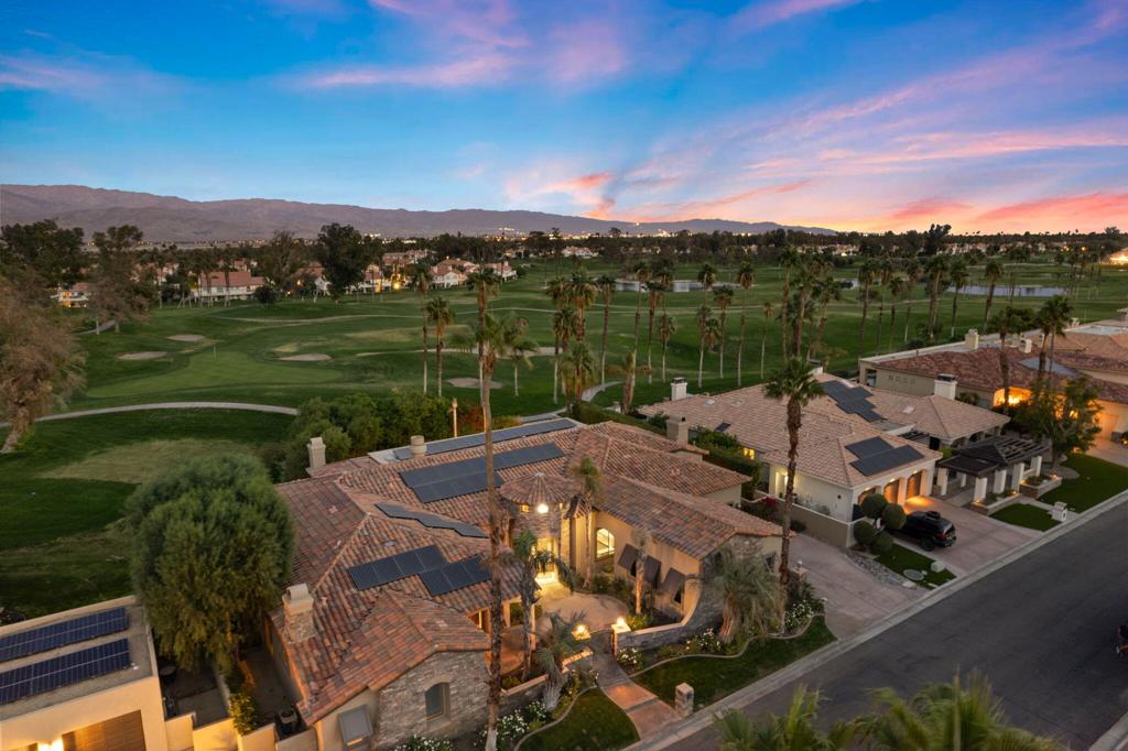 INCREDIBLE VALUE!! SOLAR OWNED!! Custom-built Tuscan estate located in the exclusive Estates at Desert Falls Country Club, a private enclave of only 23 distinguished homes. Spanning over 4,700 square feet, this sophisticated residence is perfectly situated on a unique lot, offering privacy and serene golf course views with stunning mountain backdrops. Nestled behind a second set of gates, this home is a true retreat. The open-concept floor plan boasts soaring 12-14-foot ceilings, inviting natural light into the Great Room and kitchen/family area, complete with a striking granite slab island and a cozy second fireplace. Glass sliders open to a private backyard oasis featuring a sparkling pool, spa, and panoramic views. The luxurious Master Suite is a haven of relaxation, featuring a private seating area, a third fireplace, and an opulent en-suite bathroom with a soaking tub and dual walk-in closets. A separate attached casita, with its own private entrance and fourth fireplace, offers ultimate versatility and privacy for guests or extended family. Additional highlights include a gated front courtyard, a third en-suite bedroom, and meticulous attention to detail throughout. The Estates at Desert Falls offers an unparalleled lifestyle, with country club amenities such as a state-of-the-art health and fitness center, tennis, pickleball, and a championship resort golf course. Welcome home at Desert Falls Estates!