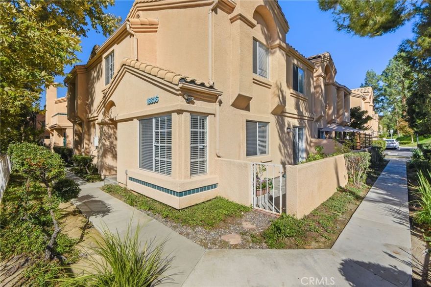 Rare complex corner unit! Welcome to a beautifully maintained townhome tucked away in a peaceful Newhall community. This corner unit sits in a prime rear location, offering added privacy, elevated neighborhood views, and a tranquil atmosphere

Inside enjoy an open floor plan designed for comfort and easy living. The spacious living room features elegant tile flooring, crown molding, and a cozy two-sided fireplace,  perfect for relaxing evenings or entertaining guests. The dining area includes a ceiling fan and flows naturally into the kitchen, which offers plenty of counter and cabinet space, a walk-in pantry, tile flooring, and a full set of appliances including a stove, microwave, and dishwasher.

Upstairs, the primary bedroom stands out with vaulted ceilings, generous space, and a private full bath. Two additional bedrooms and a hall bath provide flexibility for work, rest, or guests. You’ll also appreciate the convenient upstairs laundry closet with built-in storage.

Enjoy thoughtful touches like linen cabinets, a downstairs powder room, and a two-car garage. The home’s corner placement enhances natural light and creates a wonderful sense of openness.

This residence is ideally located near freeway access, shopping, and dining, making everyday living both easy and convenient. Whether relaxing by the fireplace, hosting friends, or taking in the view from your windows, this home offers the space and features you’ll love to come home to.