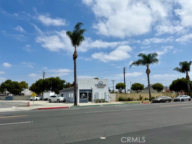 Prime Commercial Property in High Demand Location. Fantastic opportunity to own a versatile 1,700 sq. ft. building on a generous 11,548 sq. ft. lot with excellent visibility on a major street, within steps away from Bellflower City Hall and Courthouse. The property features a welcoming lobby with reception desk, two private offices, an open work area with three desk stations, a kitchen with dining space, and two half bathrooms. Additional highlights include a built-in storage area, large private backyard, and six dedicated parking spaces. All furniture is included, making this a turnkey, move-in ready property, perfect space for a law office, insurance agency, or other professional business looking to establish a strong presence.