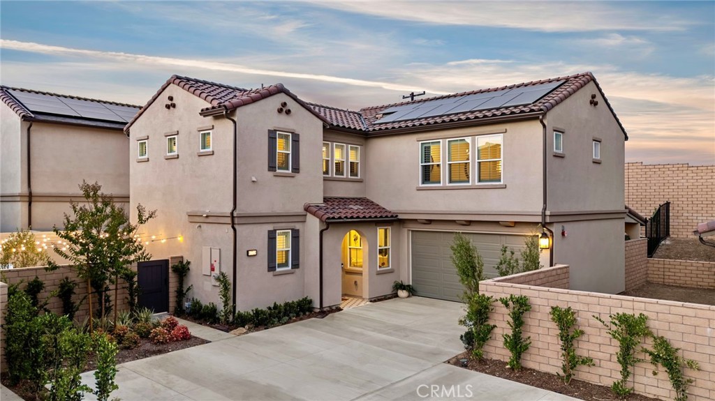 Brand New Build - Discover modern living at its finest with this newly built residence featuring paid-off solar panels, oversized lot with parking for up to 10 cars, and a sleek open-concept design. Inside, enjoy smooth wall finishes, engineered wood floors, all-glass staircase, custom brick accent wall, and designer chandeliers from West Elm & CB2. A chef’s kitchen with high-end built-in appliances, spa-inspired bathrooms with smart toilets & custom showers, and built-in surround speakers with smart-home features elevate your lifestyle. Outside, relax in the California Room, travertine patio with custom BBQ & fireplace, epoxy-coated garage, and professionally designed landscaping.