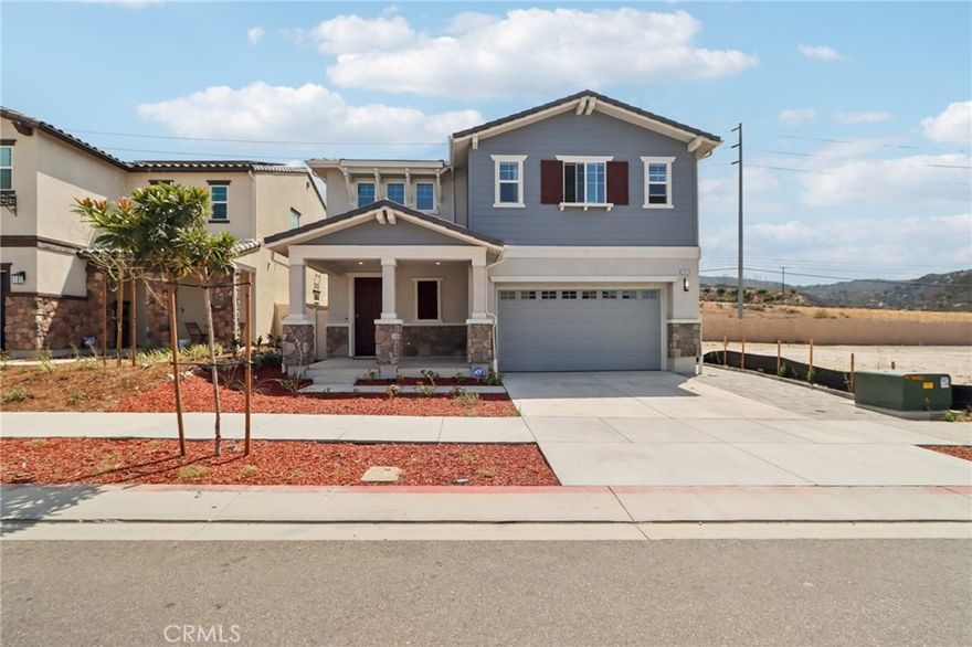 Welcome to this newly built two-story home offering 5 bedrooms and 3 bathrooms across 2,387 sq ft of thoughtfully designed living space. The main level features an open floor plan with a spacious living and dining area, a modern kitchen with quartz countertops, a large center island, a single basin sink, stainless steel appliances, soft-close cabinetry, and a walk-in pantry for ample storage. Stylish laminate flooring flows throughout the downstairs, while plush carpet in bedrooms enhances the upstairs comfort. High ceilings, recessed lighting, central A/C and heat, and an Energy Star–qualified smart thermostat create both elegance and efficiency. The luxurious master suite boasts dual sinks, a soaking tub, a walk-in shower, and a generous walk-in closet. A versatile loft and an upstairs laundry room with washer/dryer hookups add convenience, while the downstairs bedroom provides flexibility for guests or multigenerational living. Outside, enjoy mountain views, a welcoming front porch, and access to community amenities including a pool, park, and guest parking—all with low HOA fees. Complete with a 2-car attached garage and a prime location near schools, shopping, and dining, this home is the perfect blend of comfort, style, and functionality.