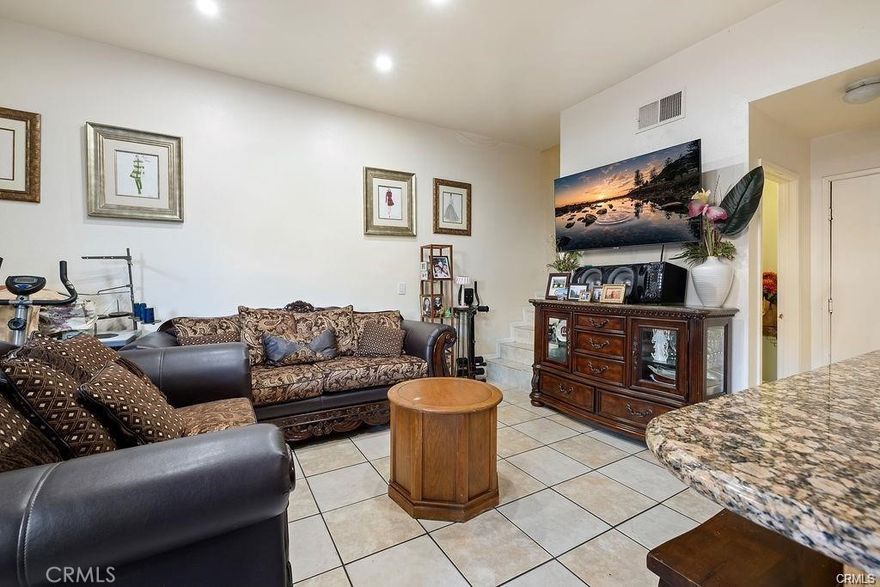Welcome to 14520 Plummer St #21 – a spacious and well-maintained two-story condo offering 4 bedrooms and 3 bathrooms. This inviting home features an open and functional layout, perfect for both everyday living and entertaining. The living room boasts a cozy fireplace, while the primary bedroom impresses with high ceilings, enhancing the sense of space and comfort. Additional highlights include an attached garage, in-unit washer and dryer, and access to a well-maintained community pool, ideal for relaxing and enjoying sunny days. This condo is the perfect blend of comfort, convenience, and lifestyle.