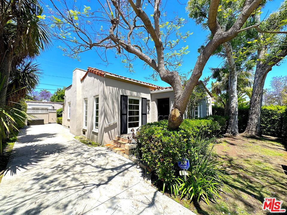 Charming Spanish villa located in one of West Hollywood's most desirable neighborhoods. This 3 bedroom, 2 bath home is fully hedged from the street and perfectly suited as a residential and/or office space. Features include a spacious kitchen with separate breakfast room, formal dining area, beautiful hardwood floors, separate enclosed laundry room with washer/dryer and a private yard with large grassy area, outdoor dining space and patio. There's a long driveway for excellent on-site parking. Conveniently located within walking distance to all the best boutiques, restaurants and shops that Robertson, Melrose and Beverly Blvd have to offer. Available for immediate move-in.