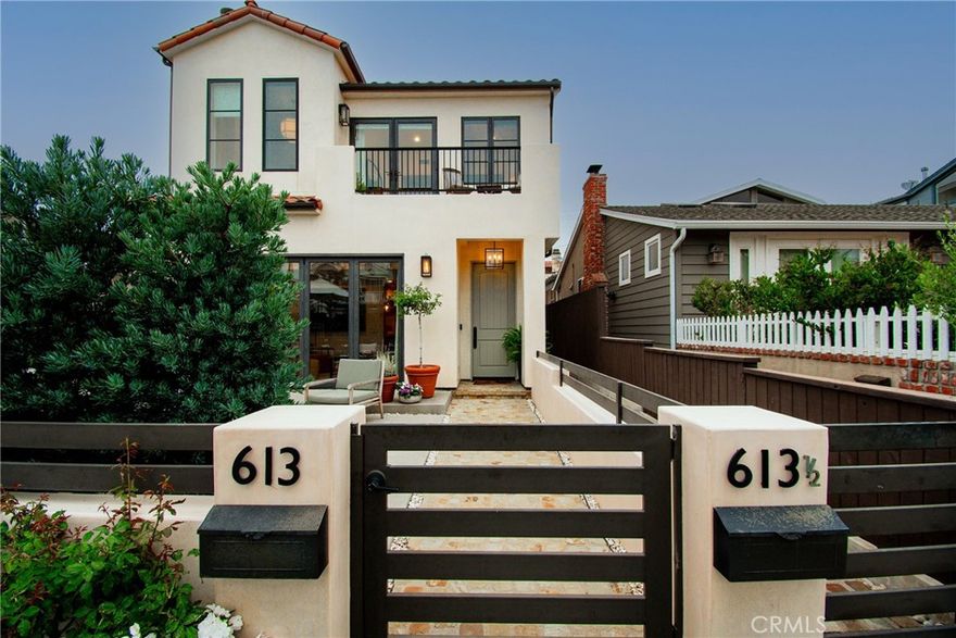 Located in the heart of Corona Del Mar Village, on one of the best streets, is this exquisite front unit 3 bedroom, 2.5-bathroom residence offering approx 2000 sq feet ( per tax)of  casual luxury living,and meticulous attention to detail. As you step inside, you'll be greeted by an abundance of natural light and an airy ambiance, thanks to bi-folding glass doors that seamlessly connect the living room to the large front patio. Perfect for indoor-outdoor entertaining or simply soaking up the California sunshine. The living room boasts a cozy fireplace with custom cabinetry and mantle, creating a warm and inviting atmosphere for gatherings with friends and family. The open floorplan effortlessly flows into the dining room and kitchen, featuring designer-appointed finishes.  Unleash your culinary skills in the gourmet kitchen, equipped with natural stone countertops, high end appliances, and a convenient breakfast bar. This home offers an oversized bedroom downstairs and full bath. The master  bedroom suite, which has an expansive walk-in closet and a luxurious en-suite bathroom with dual vanities and a walk-in shower and custom soaking tub also has a balcony to view the sunsets. Other highlights of this stunning home include a 1 car garage with carport and patio off the back door leading to the garage. Located just a short walking distance from Grant Howard Park which is fun for dogs, and children in the play area and also features a community center. Renowned restaurants and easy access to Corona del Mar Village and the beach. Don't miss this fantastic  opportunity to make this stunning home yours.  TREMENDOUS PRICE REDUCTION
