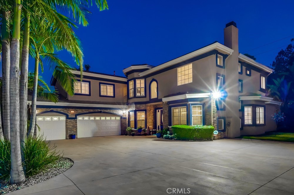 Welcome to the home of your dreams. This spacious and modern estate is filled with natural light and features soaring ceilings, offering exclusive privacy and serenity. From the moment you drive up to your private driveway, you are greeted by a large motor court with a three-car garage. Once inside, you are greeted with a 20-foot ceiling that sets a tone of elegance throughout the home. Each room is accented with crown molding, upgraded base molding, recessed or specialty light fixtures, bullnose corners, and plantation shutters. The home features 5 spacious bedroom suites with bathrooms, along with a 6th bonus room/office. The primary suite is a personal retreat, featuring wood floors, a soaking tub, two walk-in closets, and ample space for large furniture. Upstairs includes a large secondary family room or exercise area. The kitchen is a chef's dream with terrific counter space and storage. High-end appliances include an LG French-door refrigerator, a Thermador double oven with convection, a dishwasher, and a 36" cooktop. Counters are all granite with custom cabinets. A center island, farm-style sink, and large pantry complete this fantastic kitchen. A monitored security system and closed-circuit camera surveillance protect the home. A premium Bruno Elite Indoor Chair lift is included. The charm of this custom estate extends to the outside of the home. It sits on approximately half an acre and features a cozy, covered patio area for outdoor enjoyment. This lush oasis is also enhanced with numerous green plants, mature fruit trees, including loquat, lemon, and orange, as well as accent lighting to enjoy in the evening hours. The attached garage offers direct access and accommodates up to 3 vehicles. RV/ boat parking space next to the garage. The home is in the desirable South Hills School District and offers convenient freeway access. Please view virtual tour , then schedule a private showing today to see this amazing one-of-a-kind residential opportunity.