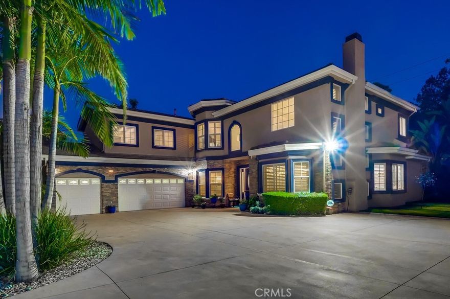 Welcome to the home of your dreams. This spacious and modern estate is filled with natural light and features soaring ceilings, offering exclusive privacy and serenity. From the moment you drive up to your private driveway, you are greeted by a large motor court with a three-car garage. Once inside, you are greeted with a 20-foot ceiling that sets a tone of elegance throughout the home. Each room is accented with crown molding, upgraded base molding, recessed or specialty light fixtures, bullnose corners, and plantation shutters. The home features 5 spacious bedroom suites with bathrooms, along with a 6th bonus room/office. The primary suite is a personal retreat, featuring wood floors, a soaking tub, two walk-in closets, and ample space for large furniture. Upstairs includes a large secondary family room or exercise area. The kitchen is a chef's dream with terrific counter space and storage. High-end appliances include an LG French-door refrigerator, a Thermador double oven with convection, a dishwasher, and a 36" cooktop. Counters are all granite with custom cabinets. A center island, farm-style sink, and large pantry complete this fantastic kitchen. A monitored security system and closed-circuit camera surveillance protect the home. A premium Bruno Elite Indoor Chair lift is included. The charm of this custom estate extends to the outside of the home. It sits on approximately half an acre and features a cozy, covered patio area for outdoor enjoyment. This lush oasis is also enhanced with numerous green plants, mature fruit trees, including loquat, lemon, and orange, as well as accent lighting to enjoy in the evening hours. The attached garage offers direct access and accommodates up to 3 vehicles. RV/ boat parking space next to the garage. The home is in the desirable South Hills School District and offers convenient freeway access.  Please view virtual tour , then schedule a private showing today to see this amazing one-of-a-kind residential opportunity.