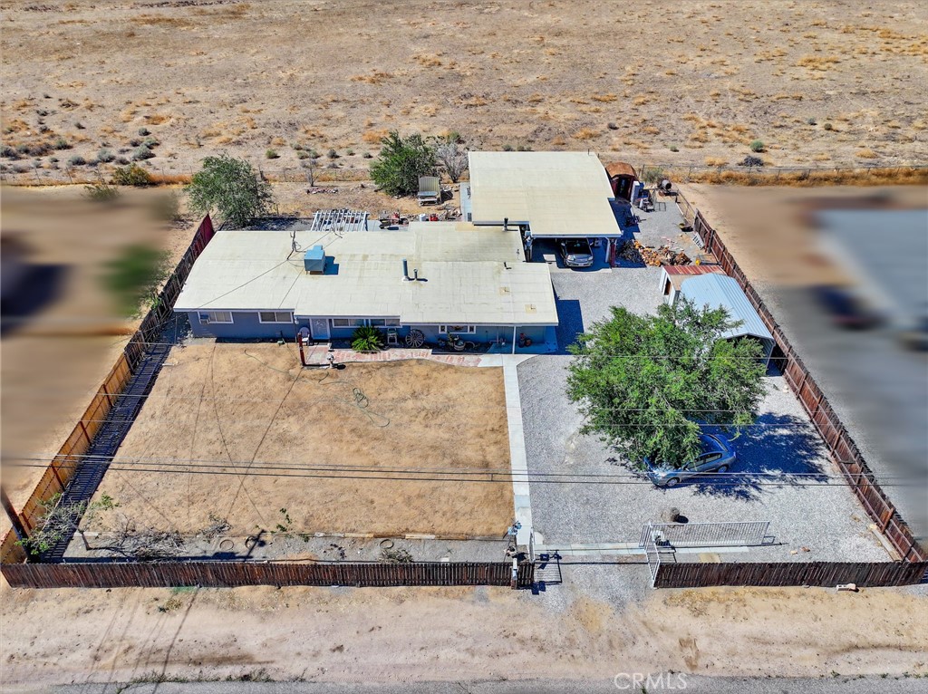 Come Discover Centennial Charm with Modern Peace of Mind! Tucked away on the quiet Centennial Street in Hesperia, this four-bedroom, two-and-a-half-bath gem has stood the test of time, but all the important pieces are refreshingly new! With a five-year-old roof, brand new PEX and stainless steel plumbing, a new tankless water heater, and a septic system replaced just three years ago, this home blends vintage soul with modern essentials.
Step outside and take in the breathtaking canyon views, where the only soundtrack is the gentle rustle of the breeze and the cheerful songs of the birds. A detached garage with its own restroom makes the perfect workshop, studio, or man cave. And with a spacious carport ideal for an RV, gated entry, and ample parking, there’s room for all your tools, toys, and imagination.
The kitchen has been recently refreshed, creating the perfect launchpad for you to bring your own style and vision to the rest of the home’s interior. Come take a peek, and picture what it could become when it’s all yours.