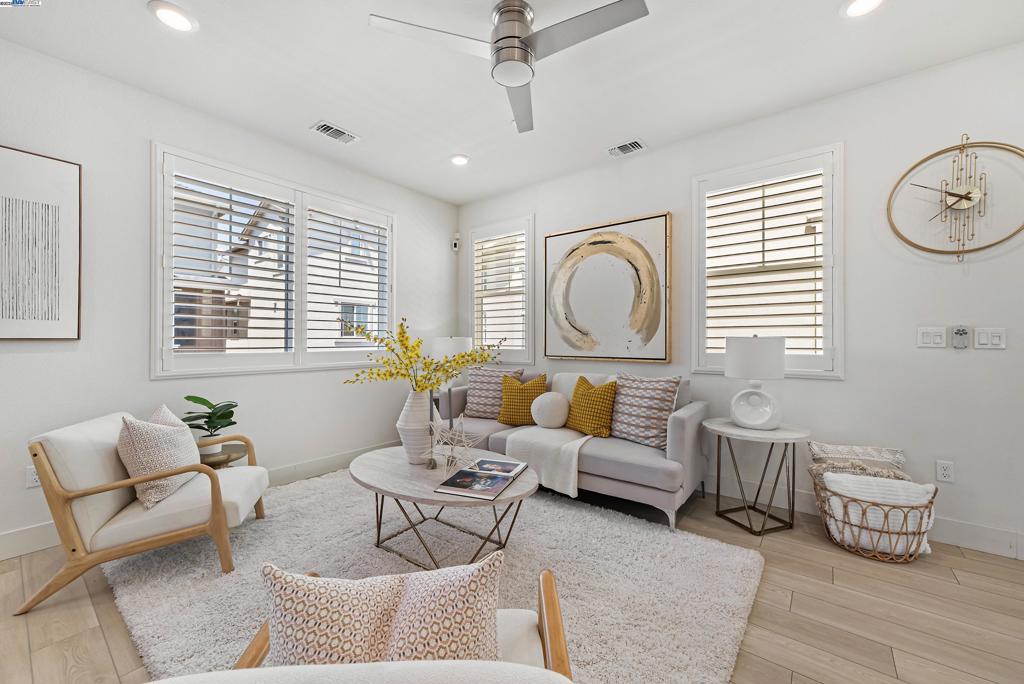 This modern 3 year-old home, situated on a peaceful corner lot, showcases contemporary luxury and smart living solutions with paid-off solar panels, ensuring remarkable energy efficiency.The second floor is adorned with upgraded luxury vinyl plank flooring, creating a bright and inviting atmosphere. The sophisticated kitchen stands out with its exquisite quartz countertops, expansive island, and upgraded appliances, all enhanced by a full backsplash. The open-plan design links the kitchen to a spacious living area, seamlessly extending to a covered patio for effortless indoor-outdoor living.A generous suite on the first floor offers versatility, perfect for a guest room or private office. With three bedrooms and three and half bathrooms distributed over 1,984 square feet, this home offers ample space for relaxation and entertainment. The backyard is a low-maintenance haven, complete with beautifully installed pavers, ideal for enjoying the quiet surroundings. Bridgeway residents enjoy a host of amenities like a clubhouse, a swimming pool, dog park, and playground. Nearby National Wildlife Refuge offers open space with trails and nature to explore. The communicty is close to Meta and Tesla, among other major employers. Easy access to Dumbarton bridge and I-880.