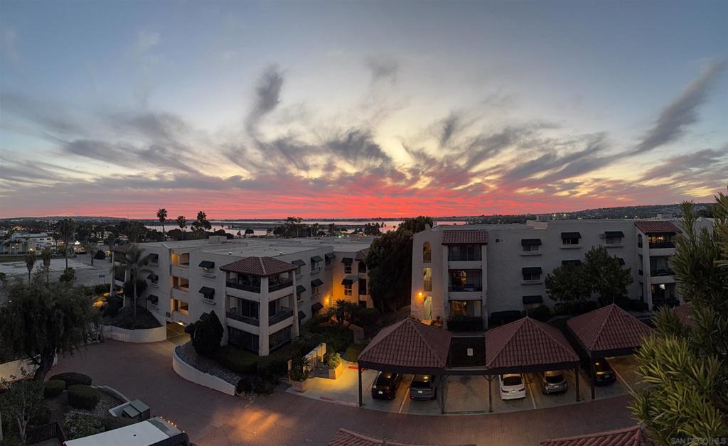 Welcome to Bay Park living with water views! This light and airy TOP-FLOOR, corner unit condo offers stunning Mission Bay views and a perfect blend of comfort and style. A mirrored accent wall in the main living space enhances the open feel and reflects the beautiful bay views beyond. The updated kitchen features bright white cabinetry, new quartz countertops, and a new stainless-steel sink and new faucet. All the appliances were replaced in 2020, further accenting the updated feel. Enjoy a seamless indoor/outdoor lifestyle with an enclosed wraparound balcony overlooking the sparkling pool. Views of Mission Bay make this space ideal for relaxing with a morning coffee or watching the sunset. The spacious primary bedroom offers plenty of room to unwind, complete with a walk-in closet for ample storage. Easy parking access with two covered tandem parking spaces directly below the unit on the ground floor. Located in the heart of Bay Park, the Costa Viva condo community features two pools and just minutes from some of San Diego’s favorite local spots. Grab a bite at Luce Bar & Kitchen or Bay Park Fish Company, explore the trails at Tecolote Canyon Natural Park, or head to nearby Mission Bay for paddleboarding, biking, and beach days. With quick access to I-5, Downtown, and Pacific Beach, this central location, just over 1 mile to the nearest trolley station, makes it easy to enjoy everything San Diego has to offer.