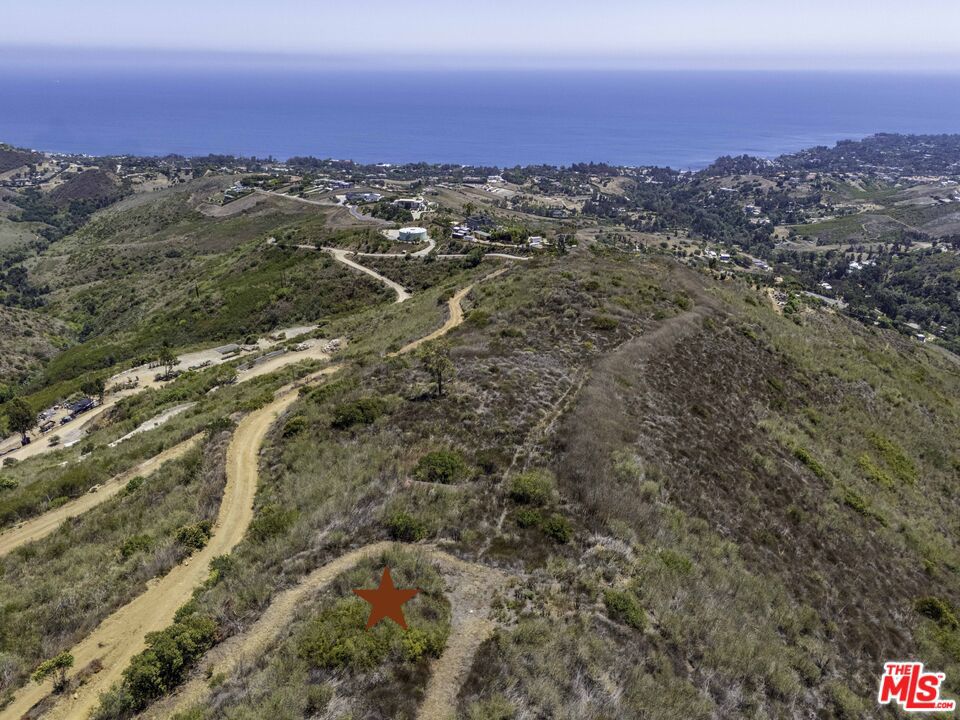 Spectacular panoramic views from this three acre parcel in the highly coveted Murphy Way area of Malibu. Overlooking Zuma, Point Dume and the Winding Way area, this lot has arguably some of the best views available. Ocean, city light and coastline views are prominent from the building pad just off the road. Ready to be developed, the land is just outside the incorporated city limits allowing for permitting through Los Angeles county. Adjacent to two lots that are also on the market, the area is quickly becoming home to large view estates. Buy now and benefit from recent development and rise in prices.
