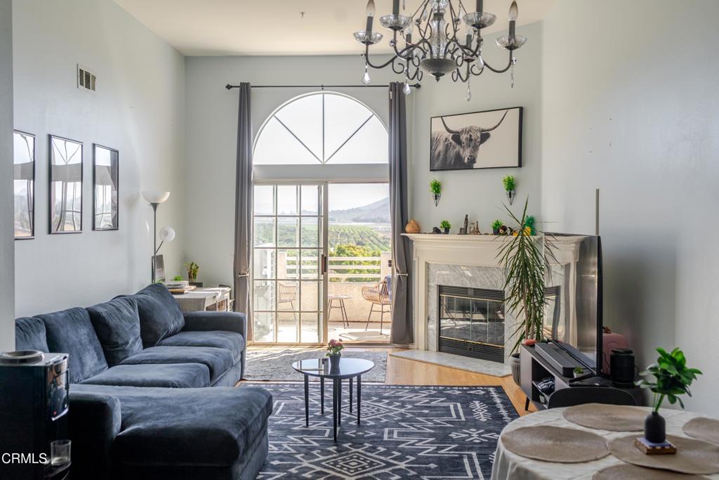 Spacious top-floor condo with vaulted ceilings, abundant natural light, and a cozy fireplace in the living room. The private laundry room includes a washer, dryer, and extra storage space, plus the home offers a well-functioning A/C unit, rare for this community. An inviting balcony provides the perfect spot to relax, BBQ, and enjoy the views, and pets are welcome. The private two-car garage is conveniently located and visible from your front door. Community amenities include a pool, spa, tennis courts, clubhouse, and RV parking. The HOA covers water, hot water, sewer, trash, fire insurance, landscaping, roofs, RV parking, and more, making this carefree condo living at its best. Ideally located in a prime Camarillo area near CSUCI, just minutes from the beaches, with easy freeway access, and close to the library, shopping, dining, medical facilities, parks, schools, and transportation. Best of all, this home comes with an assumable loan at an unbeatable interest rate--a rare opportunity in today's market!