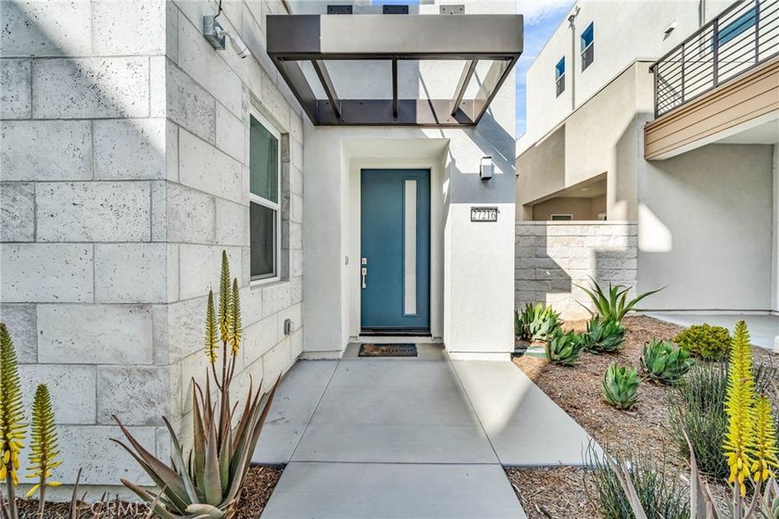 **Beautiful, Light-Filled Home for Lease in FivePoint Valencia**

Welcome to this modern and spacious home located in the highly desirable FivePoint community of Valencia. This newer residence offers an open and airy floor plan with high ceilings, recessed lighting, and an abundance of natural light throughout.

The kitchen is the heart of the home, featuring crisp white cabinetry, quartz countertops, a large center island with seating, stainless steel appliances, and a stylish vent hood. It opens seamlessly to the living and dining areas, making it perfect for everyday living and entertaining.

The primary suite is generously sized and includes a spa-inspired bathroom with dual sinks, a soaking tub, a separate glass-enclosed shower, and a large walk-in closet. Secondary bedrooms are well proportioned and versatile for guests, family members, or a home office.

Additional highlights include modern finishes throughout, wide-plank flooring in the main living areas, plush carpet in bedrooms, a full-size laundry area, and an attached garage.

Enjoy indoor-outdoor living with access to a private patio or balcony space, ideal for relaxing or enjoying your morning coffee.

Residents of FivePoint enjoy resort-style amenities including pools, parks, community gardens, trails, clubhouse, and more. Conveniently located near shopping, dining, schools, and easy freeway access.

This home is clean, move-in ready, and offers the comfort and lifestyle FivePoint is known for.