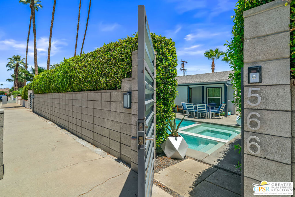 RARE!!! MAIN HOUSE + ADU in Historic Warm Sands. This exceptional property features an artistically designed 1940'S California cottage with 2 bedrooms and 2 bathrooms in the residence, plus a fabulous 1 bedroom, 1 bathroom detached ADU in the heart of Palm Springs' sought-after Warm Sands neighborhood. Brimming with VINTAGE CHARM and TIMELESS CHARACTER, this retreat offers the perfect blend of privacy, sophistication, and Palm Springs lifestyle. Enter the front gate and you are welcomed by lush privacy hedges reminiscent of a secluded compound. A modern saltwater pool and spa take center stage, surrounded by inviting outdoor spaces with a fire-pit perfect for relaxing under the stars with stunning mountain views. Inside the main house, vaulted, beamed ceilings and a cozy fireplace set a warm and stylish tone in the living room. The open dining area features sliding doors that frame the tranquil backyard oasis. The adjacent kitchen is a chef's dream, complete with professional-grade appliances and a nearby laundry closet with full-size washer and dryer. Both bedrooms in the main home feature en suite bathrooms, offering comfort and privacy. The detached ADU continues the artistic flair with vaulted ceilings, an open-concept kitchen and living area, and its own en suite bedroom. French doors lead out to the lushly landscaped backyard, while an additional private entrance from the bedroom enhances flexibility. A walk-in closet with its own full-size washer and dryer adds even more convenience. Additional highlights include a gated driveway with tandem 2-car parking. Completely walled and gated for ultimate privacy, and a premier central location just minutes from downtown Palm Springs' shopping, dining, and cultural attractions. This one-of-a-kind property is a true gem offering resort-style living, investment potential, or an ideal multi-generational retreat in one of Palm Springs' most iconic neighborhoods! A JACKPOT WINNER!