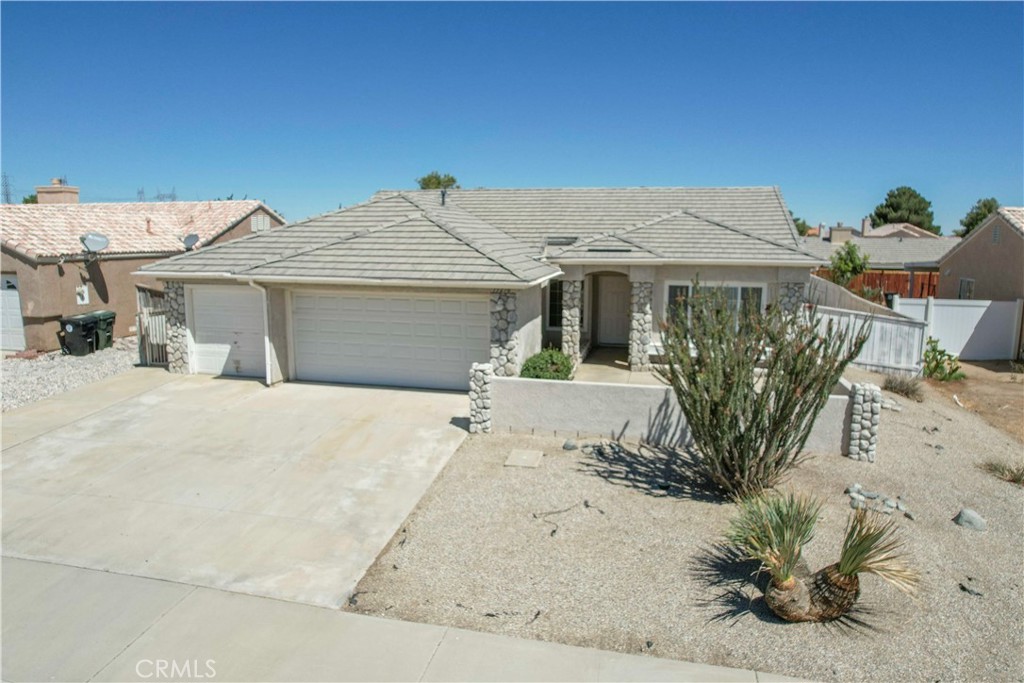 Amazing Location! Less than 5 minutes away from schools, parks, highway, freeway, dining, shopping, etc. The front yard is completely landscaped with a THREE Car Garage & driveway! The front also has an enclosed hardscaped court yard. Customize to your liking! The columns are decorated with a river rock facade. The back yard has a HUGE attached pergola that runs the length of the house. The back yard is rockscaped, hardscaped patio with walkway to front yard, & dog run. Paint the interior to the color of your choice. Floor plan makes great use of every space.