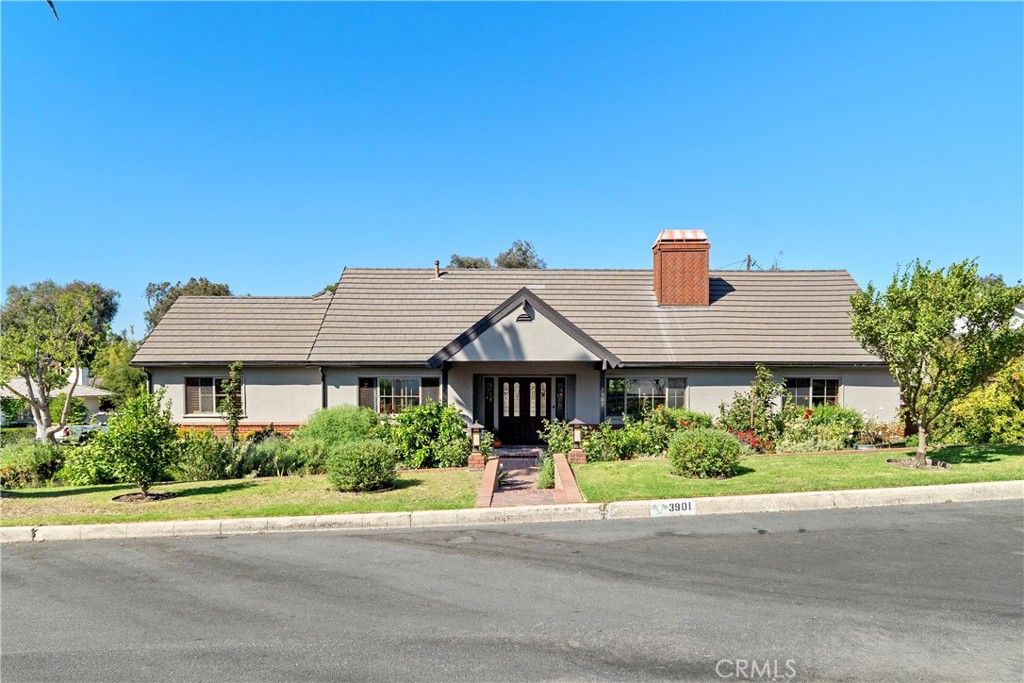 Nestled in the heart of “The Grove” in the highly coveted Valmonte neighborhood of Palos Verdes Estates, this single-level Craftsman style home sits on a large, grassy corner lot along a picturesque, palm tree lined street. Offering 3 bedrooms and 2 baths, it features approximately 2,000 sf of living space on an 8,349 sf lot, complete with a two-car garage. Step through the front doors and you’re greeted by a light-filled foyer and an open floor plan that seamlessly connects the formal dining room, a cozy reading nook, and the captivating great room with vaulted ceilings and a fireplace. New wide white-oak plank floors and expansive windows bathe the interiors in natural light, creating a warm and welcoming atmosphere. On the opposite wing, the updated kitchen boasts newer cabinets, quartz countertops, stainless-steel appliances, a Sub-Zero refrigerator, and a charming picture window overlooking the backyard. Two bedrooms share a stylishly renovated hall bath with a walk-in shower and a large soaking tub. A separate laundry room with built-in cabinets, laundry bins, and a sink adds convenience, while a pantry closet leading to basement wine storage, and classic plantation shutters offer thoughtful extras. The primary suite features a cedar-lined closet, an updated en-suite bath, and French doors that open to the back patio. Additional French doors between the kitchen and dining room lead to the home’s spacious outdoor retreat—complete with a striking exercise pool with a waterfall feature, a relaxing spa, and a cozy outdoor fireplace surrounded by generous deck space—perfect for indoor/outdoor entertaining. All this comes with easy off-hill access and close proximity to the PV Golf Club, PV Little League, Valmonte Gardens, Peninsula Center, and award-winning Palos Verdes schools. This is the home you’ve been waiting for!