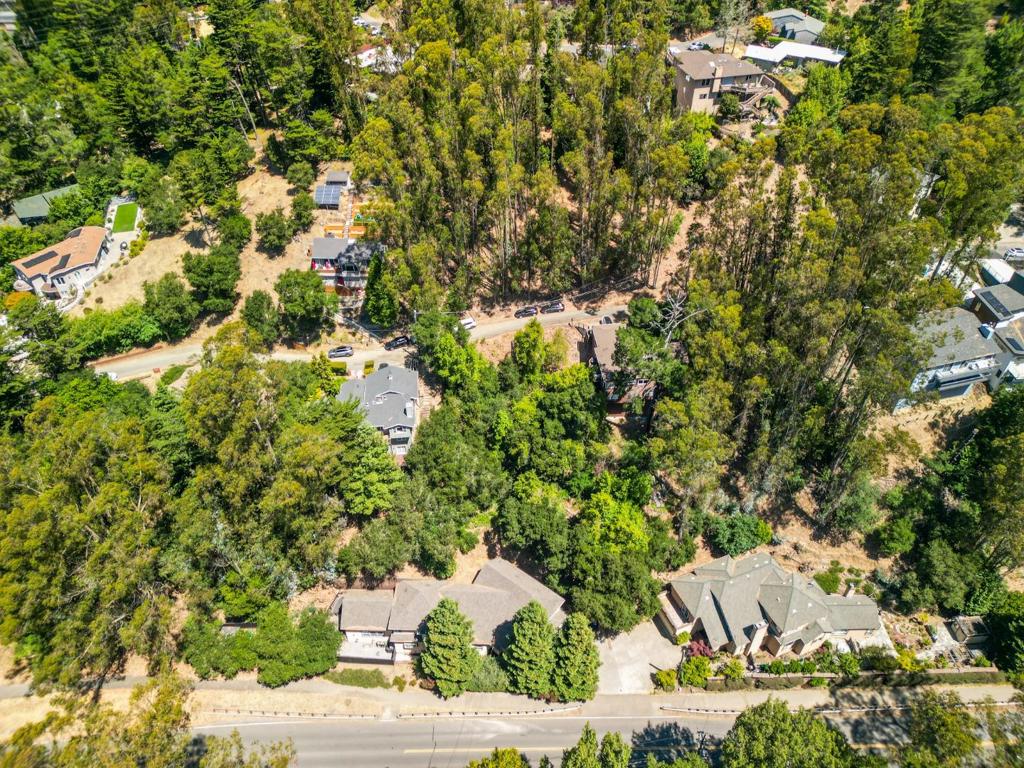 Discover the perfect canvas for your dream home nestled in the serene, wooded hills of Shepherd Canyon, Oakland. This 5,270 square feet down-sloped parcel comes with pre-drawn plans for a charming two-story residence make those blueprints reality!