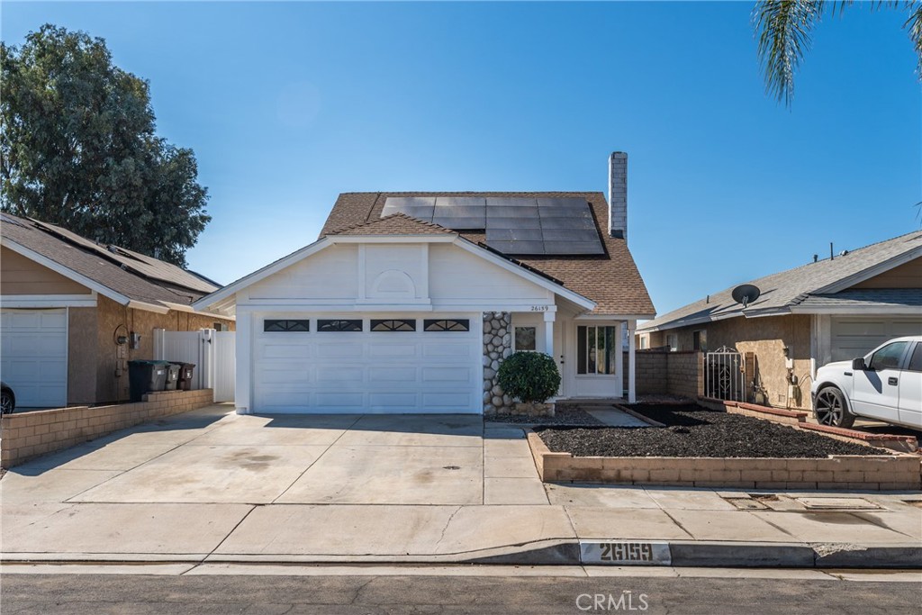 Welcome to this beautifully refreshed 3-bedroom, 2-bathroom home offering 1,352 sq ft of comfortable living space on a 3,920 sq ft lot. Freshly painted and move-in ready, this home features soaring high ceilings, tile flooring throughout the main living areas, and brand-new carpet on the stairs and in the spacious upstairs loft. The functional layout includes two bedrooms and a full bathroom on the first floor, ideal for guests or multigenerational living. The cozy fireplace and open dining area create a warm and inviting atmosphere, seamlessly connecting to the kitchen — perfect for everyday living and entertaining. Upstairs, you'll find a bright and airy loft, ideal for a home office or creative space, along with a private bedroom and an additional full bathroom. The backyard is a low-maintenance blank canvas, ready for your personal touch. Additional highlights include solar panels, a whole-house water filtration system, and no HOA! Conveniently located near Weston Park, offering easy access to outdoor recreation and family fun. Don’t miss this incredible opportunity to own a clean, updated home in a great location. Schedule your showing today and make this home yours!