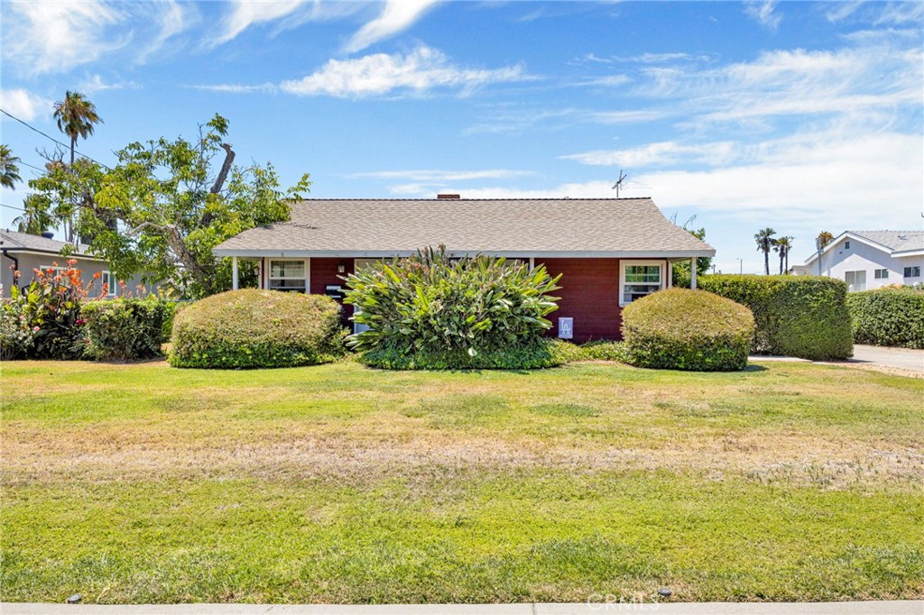Classic single-story Ranch-style home offering timeless curb appeal with its low-pitched roofline, covered front porch, and wide front yard. Featuring a functional, simple layout, wood flooring and dual pane windows, this home is ideal for comfortable living and has endless possibilities. It’s simple, clean design and inviting charm provide a perfect canvas for your personal touch. The massive lot provides generous outdoor space, perfect for gardening, entertaining, with plenty of room for future expansion.