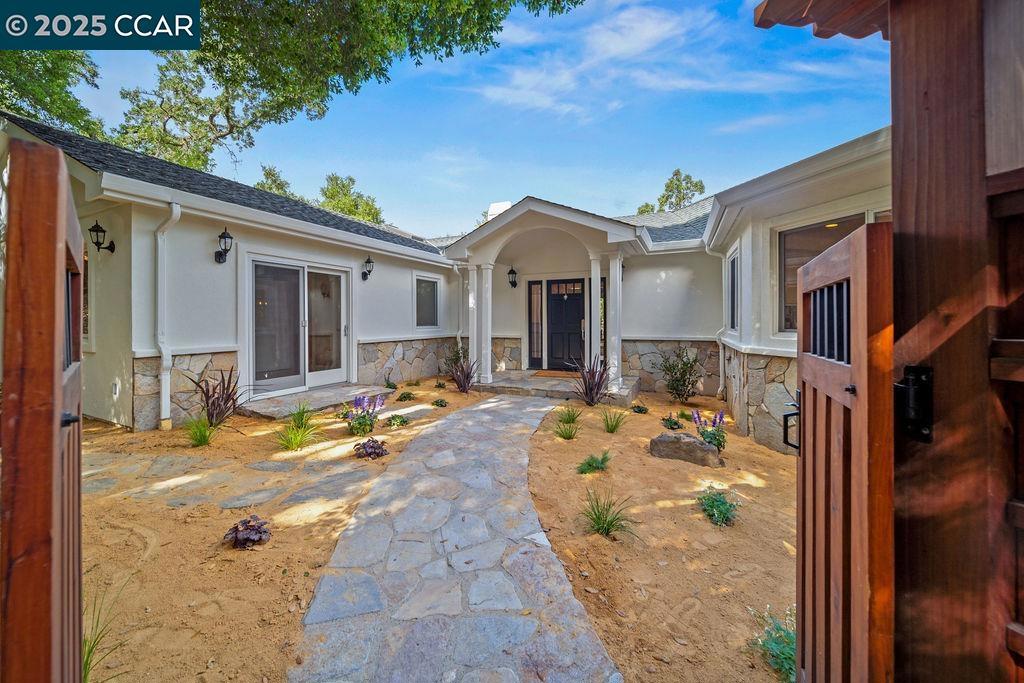 Enter this expansive home perched on a hill, and appreciate the beautiful views of the Lafayette landscape. Enjoy the privacy as well as easy access to downtown Lafayette and the Lafayette Trails. You get the best of both worlds! This 5 bedroom + Office, 4.5 bath home includes approximately ±3,600 sq. ft. of living space and sits on ±1.53 acres. The home boasts a gourmet kitchen with high end stainless steel appliances. There are hardwood floors throughout with carpet in 2 of the bedrooms. The main level of the home includes the primary bedroom/bath as well as 2 other bedrooms with 1 full bathroom. On the lower level you will find 2 more bedrooms, one bedroom includes an en suite with another 1 full and ½ bath. The floorplan of this home is very versatile. Enjoy the seclusion yet close proximity to schools, downtown, Bart and easy freeway access. You do not want to miss this great opportunity to own in Lafayette!