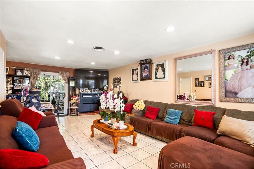 Welcome to 3413 W James, a spacious Santa Ana home featuring 5 bedrooms and 3 bathrooms with a bright, functional layout. The interior offers wood-style and tile flooring, generous living areas filled with natural light, and a well-equipped kitchen with plenty of storage. With five versatile bedrooms, the home can accommodate a large family, multigenerational living, or investment use. The backyard includes a covered patio, mature landscaping, and raised planter beds, creating a private outdoor retreat. Located less than 10 miles from Disneyland Resort and close to the Bowers Museum and Discovery Cube Orange County, this property combines comfort, space, and convenience in the heart of Orange County.