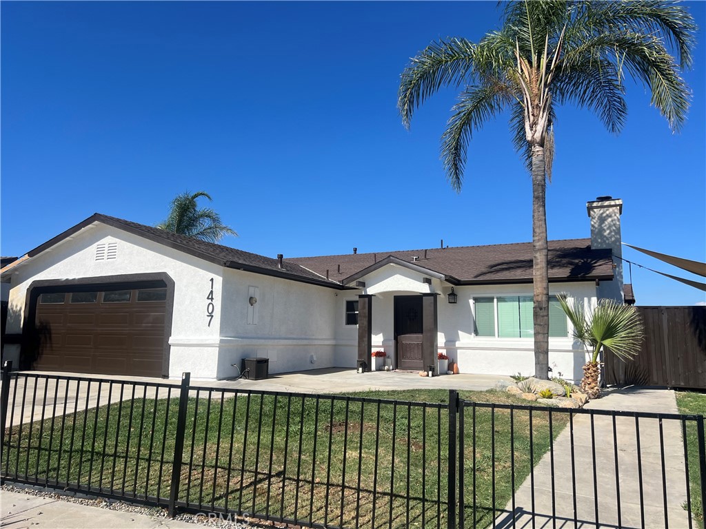This beautifully updated home offers 1,688 sq. ft. of comfortable living space with 4 spacious bedrooms and 2 stylishly updated bathrooms. Nearly every detail has been refreshed: new exterior and interior paint, new fencing, new concrete, new wood flooring, new windows, new sliding doors, and even a brand-new play yard and pergola. Inside, you’ll find soaring ceilings, recessed lighting, and a bright open floor plan. The kitchen features freshly painted cabinetry and opens seamlessly to the dining and living areas—perfect for family living and entertaining. The fully fenced 11,020 sq. ft. lot offers mature palms, grassy areas, and trees, plus two large side yards—one ideal for RV parking. The backyard includes a charming new pergola with planters and stepping stones, as well as a dedicated kids’ playground. The property extends down the hill with added storage containers and boasts sweeping mountain views. This home truly has it all and is perfect for a growing family.