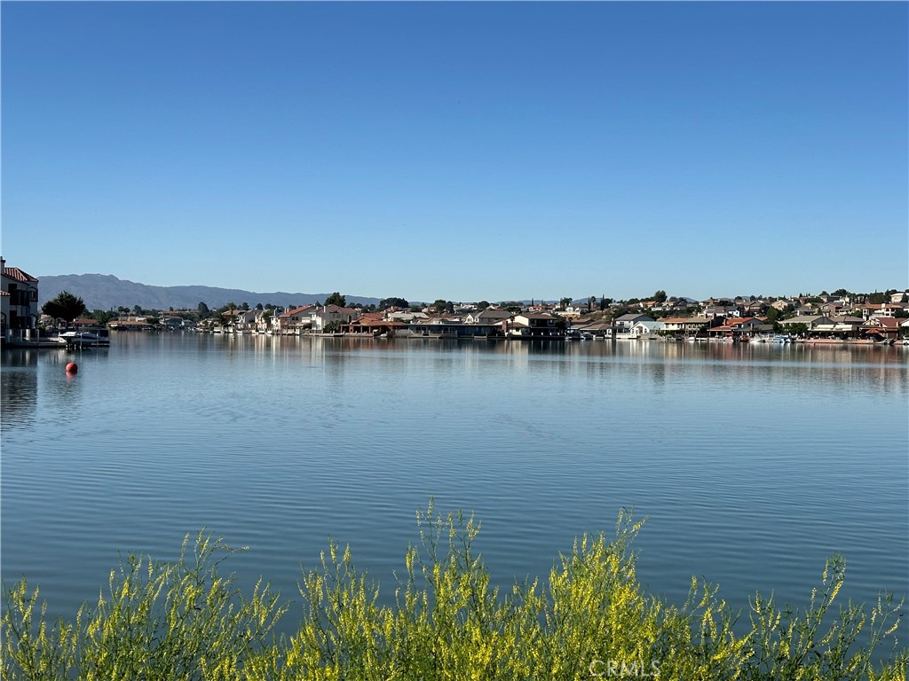 Beautiful OPEN WATER lot to build your dream home on in the highly sought after private community of Spring Valley Lake. Spring Valley Lake offers "Resort Style" living! Lot has block walls on 2 sides of property and 59' of water frontage. Out of the estimated 4,214 individually owned lots in the community, only about 197 remain vacant. Additionally, there are approximately 549 lakefront lots in total.
This community offers so much! Spring Valley Lake member amenities include a 200-acre waterski lake with marina and fuel, a beach with swimming area, a community building, three parks, fourteen fishing areas, and an equestrian center. Located within the community is an award-winning Steel Canyon Golf Club Corp. 18-hole golf course and country club. The community has a 24/7 Public Safety Department that provides professional security services on Association property, medical aid response, lake patrol and general assistance. Security in the community is further enhanced through the use of security cameras placed at all entrances.
There is a multitude of groups and classes you can join. You can attend the Summer Kickoff Concert series on the West Beach and enjoy fabulous music. There is also the fireworks display June 28th from the lake to celebrate 4th of July early. With all these amenities you can see why Spring Valley Lake has come to be known as "The Jewel of the High Desert." *Some amenities require membership to the Bear Valley Country Club.