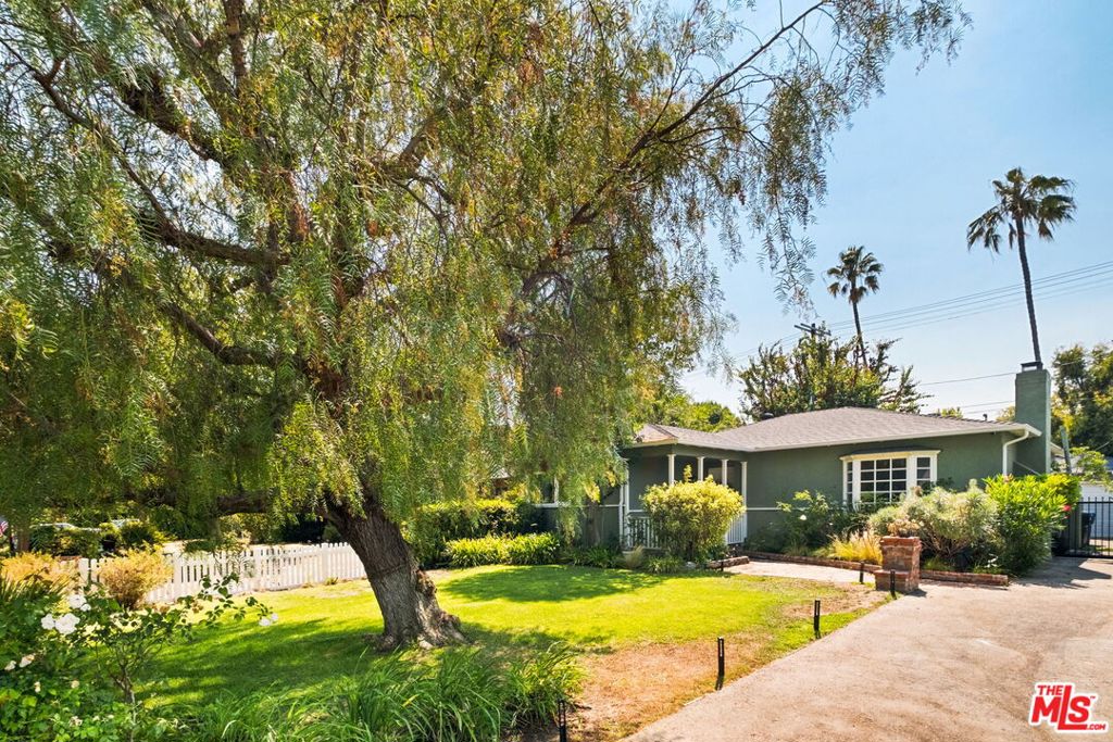 A soulful gem in the heart of Studio City, 4447 Radford Ave pairs timeless character with smart modern upgrades, just steps from the neighborhood's best-loved spots. Nestled on one of Studio City's most picturesque, tree-lined streets and located in the coveted Colfax Charter Elementary district, this 2-bedroom, 2-bath traditional-style home features a versatile bonus den/office space, ideal for working from home or expanding your living area. Inside, warm original charm meets thoughtful improvements: custom built-ins, a new AC unit, and a Tesla charger, all tailored for comfort and convenience. What sets this home apart is the rare walkability. Stroll to Ventura Place, Joan's on Third, Alfred Coffee, McConnell's, Ggiata, and the Studio City Farmers Market or explore the beloved boutiques and bakeries of nearby Tujunga Village. Just minutes away by car, Sportsmen's Lodge offers Erewhon, Equinox, Sugarfish, Rolling Greens, and other special spots. Families will love the proximity to top-tier schools, including Colfax Charter, prestigious Campbell Hall, and preschools like CNS and ABC Little School all within walking distance. The lush, private backyard is a peaceful retreat perfect for entertaining, relaxing, or future expansion. Whether you're a first-time buyer, a downsizer, or an investor seeking a rare foothold in one of Studio City's most desirable pockets, Radford offers unmatched flexibility and long-term upside. Come experience a home where community, comfort, and location truly align.