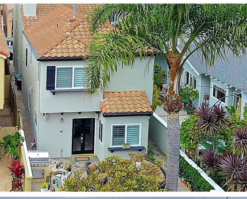 Experience the ultimate in coastal luxury with this exceptional estate in Downtown Huntington Beach, just a short walk to the iconic HB Pier, world-famous beaches, Pacific City, and the vibrant heart of Downtown. This beautifully upgraded home features 3 spacious bedrooms, a versatile loft with a wet bar and built-in mini refrigerator that opens to an expansive ocean view deck, 2 full baths, and 2 half baths. Designed for comfort and style, the interior boasts custom paint, upgraded hard surface flooring, plantation shutters, and recessed lighting throughout. Entertain with ease in the formal living room with a cozy fireplace and elegant dining room, or cook like a pro in the gourmet kitchen with quartz countertops, a custom backsplash, and new stainless steel appliances. The luxurious master suite offers a large walk-in closet, an additional wardrobe closet, and a spa-inspired bathroom with a soaking tub, shower, and dual sinks, while the secondary bedrooms share a nicely updated Jack and Jill bathroom. Additional highlights include an attached 2-car garage with ample storage, an interior laundry room, and multiple outdoor spaces, including a large front patio with a built-in BBQ center and outdoor shower, as well as a rear patio and third-level deck with stunning ocean views—perfect for relaxing or entertaining. Don’t miss this rare opportunity to live in a true coastal oasis where luxury, convenience, and breathtaking views come together in one of Southern California’s most sought-after beach communities.