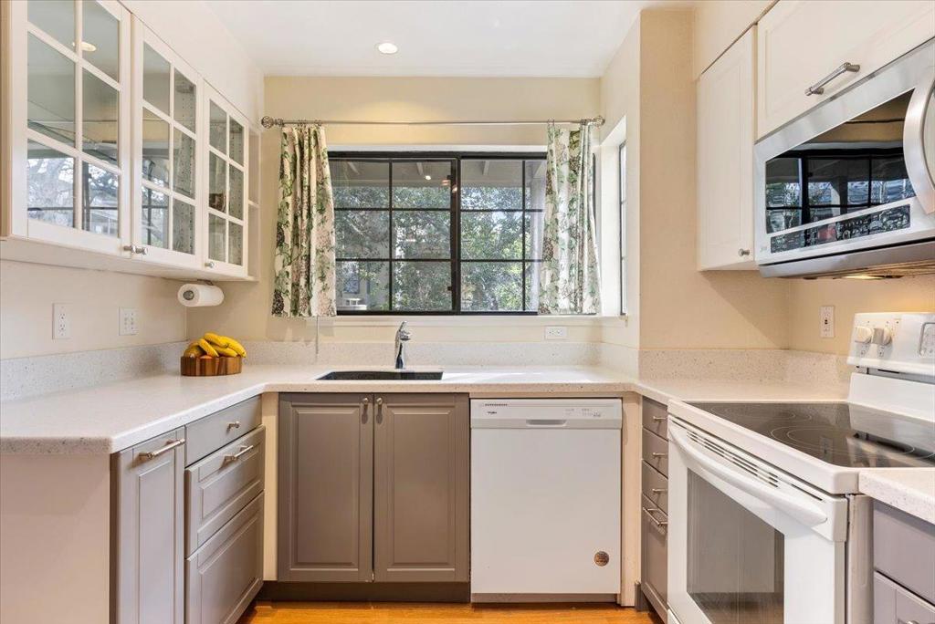 Welcome to this charming 2-bedroom, 2-bathroom condo in the desirable city of Del Rey Oaks. NO STEPS or STAIRS makes living easy! With a comfortable 1,088 sq ft of living space, this residence offers an inviting atmosphere with modern amenities. The updated kitchen comes equipped with a microwave and refrigerator, making meal preparation a breeze. Enjoy your meals in the dedicated dining area, perfect for gatherings. The home features laminate flooring throughout, providing a clean and cohesive look. Stay cozy during cooler months with the central forced air heating (new furnace in 2024) and enjoy the ambiance of a fireplace in the living area. Laundry is conveniently located inside, complete with a washer and dryer. High efficiency 50-gallon heat pump water heater (new in 2023). Relax and unwind in the in-ground spa, a perfect retreat after a long day. The covered parking space is very close to the front door. Attached deck provides covered outdoor space and is very private because of surrounding trees. Don't miss the opportunity to make this delightful Del Rey Oaks property your new home! Close to shopping, restaurants, and the Beach! There is also easy access to Highway 1 and Highway 68.