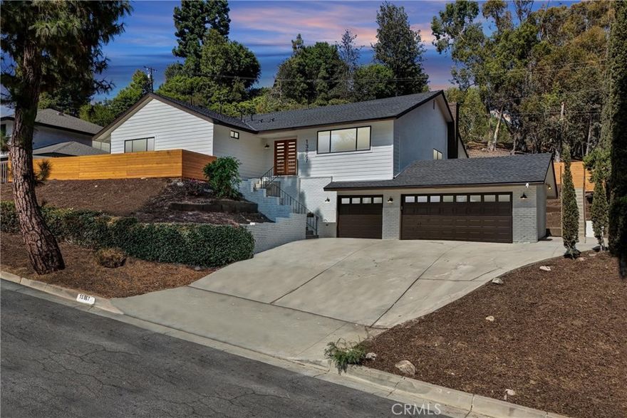 Welcome to this stunning fully remodeled 4-bedroom, 3-bath pool home located in Whittier’s highly sought-after and secluded Forest neighborhood. This move-in ready home offers modern comfort and style throughout, featuring brand-new vinyl flooring, recessed lighting, and an open, airy floor plan. The chef’s kitchen is equipped with quartz countertops, custom cabinetry, stainless steel appliances, a 5-burner oven, and a dishwasher — perfect for entertaining or family gatherings. Enjoy year-round comfort with a brand-new A/C and HVAC system. The home also includes convenient in-house washer and dryer hookups. Each bathroom has been tastefully updated with designer finishes, and the spacious primary suite offers direct access to the backyard retreat. Step outside to your private oasis featuring a sparkling remodeled pool, new decking, and mature trees providing shade and privacy. A rare 3-car garage adds ample parking and storage. Ideally located near Uptown Whittier, shops, dining, and scenic trails — this is a true Whittier gem offering resort-style living in a peaceful setting.