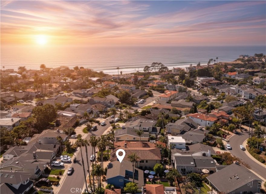 Just a short stroll from Lasuen (Lost Winds) Beach, one of San Clemente’s most iconic stretches of sand, 214 Calle Marina offers a rare opportunity to embrace the coveted Southwest lifestyle for under $2.5M. This 3-bedroom, 2.5-bath coastal retreat balances laidback charm with thoughtful updates, all set on one of the area’s most desirable streets. The main level features two comfortable bedrooms and a full bath upgraded with a deep soaking tub and shower—perfect after a day in the waves. Wood-look tile floors flow throughout, combining breezy style with easy beachside maintenance. A brick fireplace anchors the living room, while a breakfast nook invites casual dining with garden views. The kitchen is both warm and functional, outfitted with Samsung appliances including a smart oven, soft-close cabinetry, pull-out sliding shelves, corner lazy susans, and a butcher block island—designed with abundant storage and everyday ease in mind. Upstairs, the primary suite feels like a private escape with a walk-in closet, dual sinks, and a spacious walk-in shower. A loft with vaulted wood-beamed ceilings and its own brick fireplace opens to a sunlit deck, where ocean views remind you just how close you are to the sand and surf. A convenient half bath completes the space. Outdoors, the home reveals one of its rarest offerings—a large backyard with an expansive, low-maintenance turf lawn framed by mature tropical landscaping and an orange tree. It’s an inviting canvas for weekend gatherings, quiet morning coffee, or future expansion. Set in a community known for its charm, surf culture, and timeless appeal, this is more than a home—it’s an entry into the Southwest San Clemente way of life. With direct access to beaches, trails, and the vibrant heart of town, this property combines location, lifestyle, and long-term potential in a way few homes can. 214 Calle Marina is your chance to inhabit a coastal haven where the ocean is near, the setting is irreplaceable, and the possibilities are endless.
