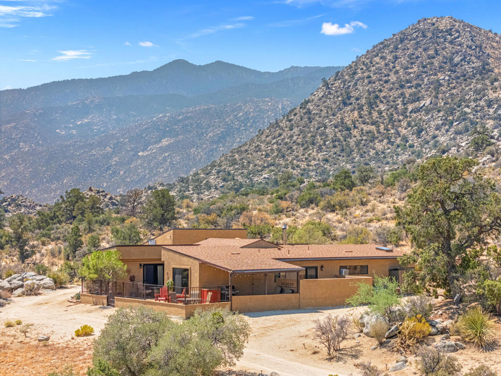 Welcome to the Hill. Perched in the desirable community of Pinyon Crest, this 3-bed, 2-bath retreat is where evenings run cooler, the stars shine brighter, and peace feels effortless. Inside, discover newer floors, a cozy wood-burning fireplace, and a sunlit brand-new kitchen complete with all appliances--including refrigerator, dishwasher, microwave, washer, dryer, and wine fridge. For added convenience, there's also a second refrigerator and large freezer in the garage. The private primary suite is its own sanctuary with a skylit walk-in closet and spa-inspired bath that opens directly to a secluded jacuzzi--perfect for soaking under endless desert skies. A versatile single-car garage has been transformed into a bright studio with built-in cabinets, a sink, and workspace--ideal for hobbies, art, or simply a quiet retreat. Daily living feels seamless thanks to community care: the HOA beautifully maintains the roads weekly and oversees the wells, with water tested yearly to ensure quality. A 3-car garage with keypad and app control, screened-in back porch overlooking raised garden beds, and a resurfaced patio bring comfort and ease to every day...And when you're ready for a night out, El Paseo's shopping and dining is just 20 minutes down the hill--though life at S.View dr may have you wanting to stay right where you are.