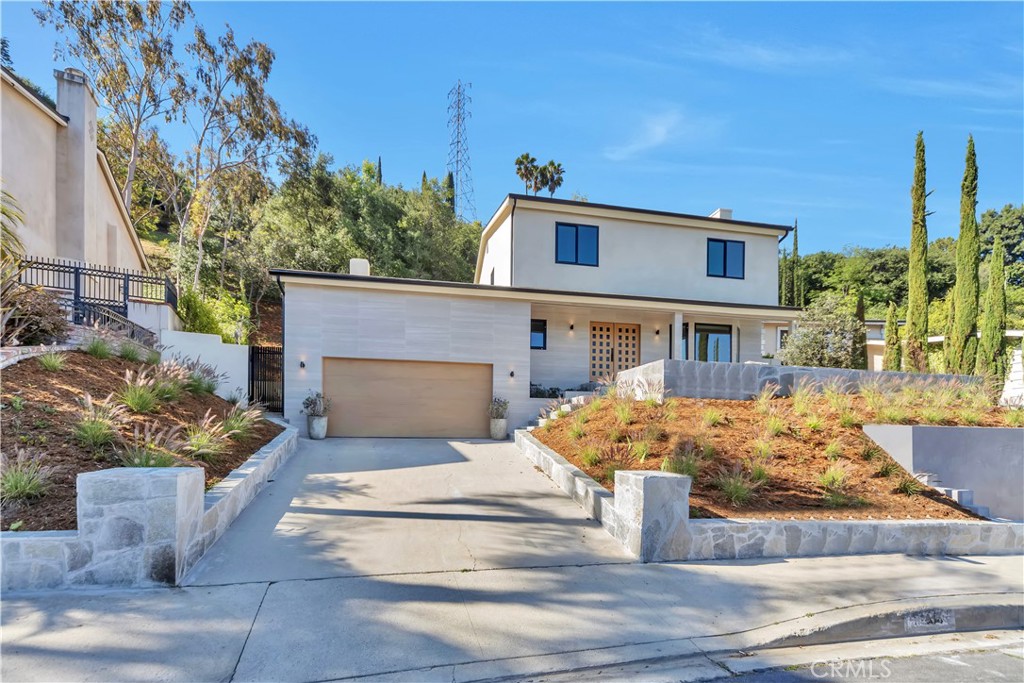 Step into this beautifully remodeled home, peacefully situated in the coveted ‘Donas’ enclave of Studio City. Perfectly combining sophisticated style and thoughtful design, this house is located within the award-winning Carpenter School District .
At its heart, the meticulously designed kitchen boasts new top-of-the-line Thermador appliances, marble countertops, custom cabinetry, a breakfast nook and high-end finishes, ensuring an elegant balance of functionality and sophistication.
The thoughtfully designed open layout includes custom fireplaces as well as a primary bedroom suite featuring a large walk-in shower and a spacious walk-in closet. Three additional well-sized bedrooms share another fully renovated bathroom, providing ample space and comfort for all.
The substantial backyard, a highlight of the property, offers generous space for outdoor activities truly capturing the essence of California living and can be accessed through family & dining rooms.
The adorned front entry and back patio invite you outdoors, where a peaceful scenery awaits for relaxing evenings. This updated Studio City home masterfully combines elegance and functionality. A serene front yard seating area complements the potential-rich backyard, creating an inviting space for all. Come experience the perfect blend of suburban tranquility and modern convenience in this exceptional South of the Boulevard home.