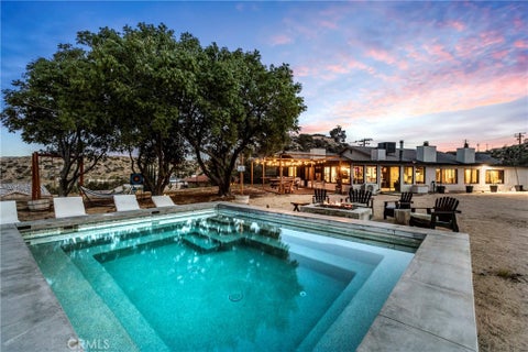 Photo of 53988 Pinon Dr, Yucca Valley, CA 92284 (MLS # CV26172079)