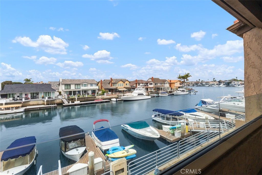 A Huntington Harbor bayfront townhome with a boat dock and two blocks to Sunset Beach. This a rare find at this price range. Enjoy Huntington Harbor and the beach lifestyle in this ideally located upper level townhome with close proximity to restaurants and shopping. This one bedroom one bath with an updated kitchen, bath & laundry room plus a large loft that could serve as a 2nd bedroom or office and vaulted ceilings in the living room and bedroom. This home is the perfect primary retreat or vacation home getaway in the heart of Surfside. Enjoy a quick coastal drive to downtown Huntington Beach and the pier. The Sea Harbour community includes a pool, spa, gym, 3 tennis courts, clubhouse and a park like setting Plus this unit has it's own private boat slip.