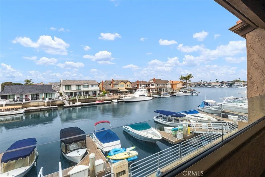 A Huntington Harbor bayfront townhome with a boat dock and two blocks to Sunset Beach.  This is a rare find at this price range. Enjoy Huntington Harbor and the beach lifestyle in this ideally located upper level townhome with close proximity to restaurants and shopping. This one bedroom one bath with an updated kitchen, bath & laundry room plus a large loft that could serve as a 2nd bedroom or office and vaulted ceilings in the living room and bedroom. This home is the perfect primary retreat or vacation getaway in the heart of Surfside. Enjoy a quick coastal drive to downtown Huntington Beach and the pier.  The Sea Harbour community includes a pool, spa, gym, 3 tennis courts, clubhouse and a park like setting Plus this unit has it's own private boat slip #17.