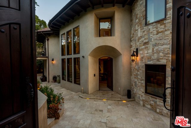 Stunning gated Tuscan Villa in prestigious Bel-Air.Panoramic views that offer an airy, bright & tranquil setting. The grand foyer w/ limestone floors throughout the home. Living room offers a grand space that leads to a grand terrace. The kitchen w/ hand painted tile back splash has antiqued cabinetry, walk in pantry, center island, dining area & bi-fold doors that lead to a terrace that offers a built in BBQ w/ a custom hood, beverage cooler & bar area.Master Bedroom suite w/ lrg sitting area overlooking views. Before getting to the master bath w/ the pedestal tub & lrg steam shower, you step into a hand built walk in closet. There are 3 other bedrooms on this floor, one is turned into an office. Downstairs has family room w/ indoor/outdoor living space, leading to a lap pool surrounded by cascading fountains. Game room w/ full bar, maid's room, guest suite w/ prvt entry, lrg laundry room & 2 bonus rooms. Smart home w/ controls 4, indoor/outdoor speakers, alarm system & elevator.
