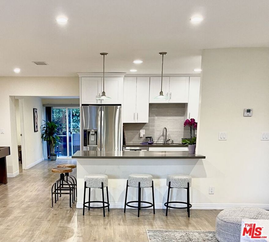 Beautifully updated 4-bedroom, 2-bath single-family home for lease in a prime South-of-the-Boulevard location. Nestled within a highly sought-after school district, this spacious residence offers walking access to shops, restaurants, and houses of worship, with an easy commute to both Santa Monica and Malibu beaches. The bright and inviting interior features a large remodeled kitchen with granite countertops, brand-new stainless steel appliances, and newly installed custom cabinetry. Both bathrooms have been tastefully renovated, while the expansive master suite creates a serene retreat. Additional highlights include a new energy-efficient central A/C system, abundant closet space, recessed LED lighting, and newly installed dual-pane windows. A private laundry area with washer and dryer provides convenience and direct access to the lush backyard, complete with mature fruit trees. The property also offers an electric vehicle (EV) fast charging station for modern living. Monthly rent details and move-in specials available upon request. Contact listing agent for additional information and showings.