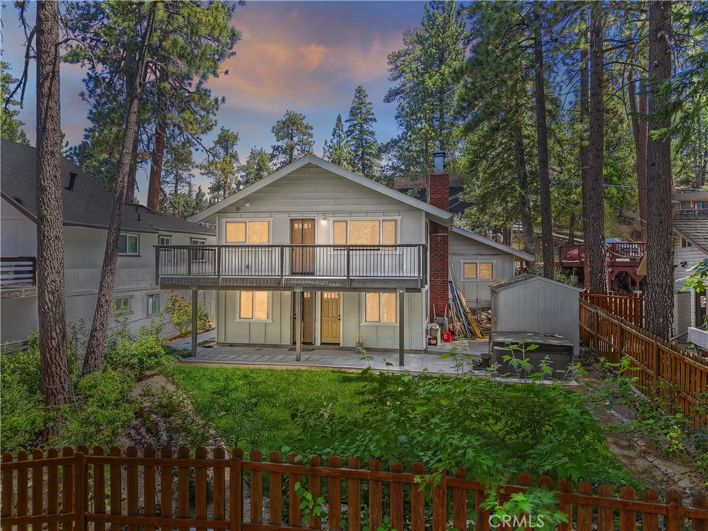 Nestled on a quiet street in the desirable Moonridge area, this extensively renovated home has 2 generously sized bedrooms plus an office, and 2 baths, offering a blend of rustic charm and contemporary finishes.
The home was completely rebuilt from the studs up, featuring new knotty alder wainscoting, cabinets, and interior doors, along with new dual pane windows, custom window treatments, and designer lighting. A modern kitchen boasts granite slab countertops and stainless steel appliances, while the upgraded electrical system—including a new 200-amp panel—ensures lasting efficiency.
New hardwood flooring, tile, and carpet enhance the home’s comfort and style. Enjoy outdoor living on the wrap-around synthetic trex-like deck, surrounded by a professionally landscaped and fully fenced backyard with mature fruit and shade trees, plus an automatic irrigation system. Complete with an attached one car garage and additional off street parking. Located just minutes from Bear Mountain-Snow Summit Ski Resorts, the Alpine Zoo, and numerous hiking and biking trails, this turn-key property offers quality craftsmanship in a tranquil mountain setting—ideal for full-time living, vacationing, or investment.