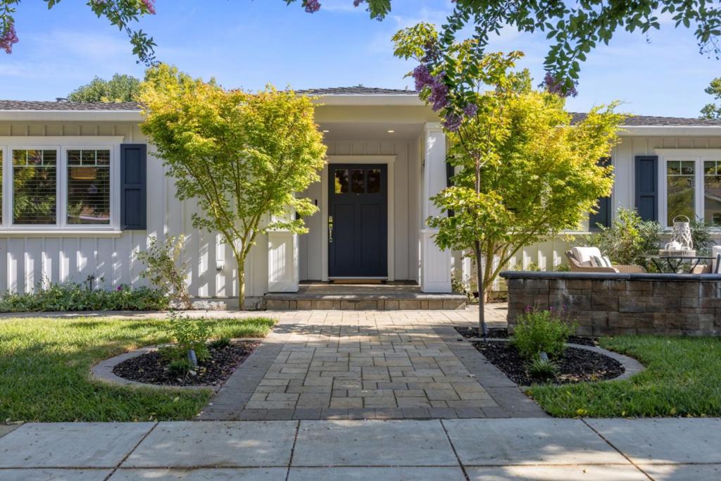 Located on a quiet street in the heart of Willow Glen, this beautifully remodeled single-level home offers 4 bedrooms and 3 bathrooms, including two primary suites. Renovated top-to-bottom in 2018, the home combines modern convenience with timeless design. Admire the oak floors, soaring 10-foot ceilings, custom built-ins, and a gas fireplace with a custom mantle anchoring the open-concept living room. A wall of double sliding glass doors leads to the backyard patio, blending indoor comfort with outdoor relaxation.The gourmet chefs kitchen is a showstopper, featuring leathered granite countertops, a Bertazzoni 5-burner gas range/ hood, expansive center island with peninsula seating,farmhouse sink, and a Kalamera wine fridge.The primary bedroom suite is a true retreat with automated blackout blinds,walk-in closet and a spa-like primary bath wiht Carrera marble, a walk-in shower and a deep soaking tub. The tranquil backyard is perfect for entertaining with a custom covered pavilion and mature landscaping for privacy and relaxation. The finished garage with built in storage and bonus artists studio in yard offer endless possibilities. Located in the highly sought-after Booksin Elementary School District, this home is the perfect blend of luxury, function, and Willow Glen charm.
