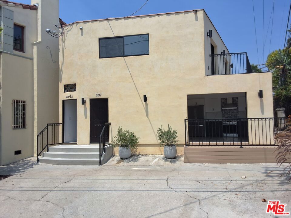 Note: the unique address for this second floor unit is 5247 1/2. Let us begin with the fact that this 730 sq. ft.(864 incl. beautiful patio) was just constructed. Enjoy being the first to run the high-end appliances. Owners have put much thought into the details, sparing no expense to ensure the interior is well-lit by a skylight and sizable hide-away balcony sliding doors and and hideaway walk-in closet doors. On a beautiful breezy day, the balconies give the tenant the sense that the unit is twice as large. The second floor openness gives it a fancy tree-house feel. Details include masterfully selected and installed tile, stone, and a light hardwood throughout. Well selected granite counter tops adorn the open kitchen. It's an eye-catcher.