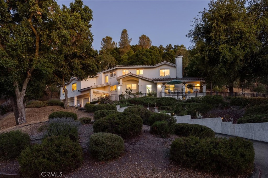 With panoramic views and timeless upgrades, 9230 Las Lomas Avenue offers refined living just steps from Chalk Mountain Golf Course. Perfectly positioned to capture scenic mountain and golf course views, this beautifully maintained 3-bedroom, 3-bathroom home offers 2,877± sq ft of stylish living space on a generous 39,000± sq ft lot in one of Atascadero’s most desirable neighborhoods. Inside, the spacious and light-filled layout features a chef’s kitchen designed for both function and flair — with sleek quartz countertops, rich cabinetry, stainless steel appliances, a walk-in pantry, and a large center island with breakfast bar. The open floor plan is ideal for entertaining, and updated flooring through the main living areas enhances the clean, modern feel. The generous primary suite provides a relaxing escape, complete with dual vanities, a soaking tub, a private bidet, and a peaceful ambiance that invites rest and rejuvenation. Two additional bedrooms and baths offer space and flexibility, while the dedicated laundry room and attached 3-car garage add everyday convenience. Thoughtful features include owned solar for energy efficiency, a central vacuum system for easy cleaning, and a small climate-controlled wine cellar — perfect for storing your favorite Central Coast vintages. Step outside to your expansive view deck and take in the beauty of the Central Coast — from golden sunrises over the mountains to peaceful afternoons watching golfers and deer pass by. Whether you're sipping morning coffee, enjoying a glass of wine at sunset, or entertaining guests, this outdoor setting is truly special. Blending comfort, sophistication, and nature, this move-in-ready home offers an exceptional opportunity in a peaceful and scenic location. Don’t miss your chance to make it yours — schedule your private showing today!