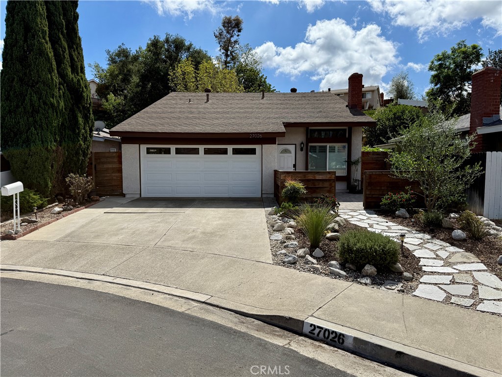 Welcome to this move-in ready 4 bedroom home located on a quiet cul-de-sac! This light and bright residence features an open floor plan with vaulted ceilings, a cozy fireplace, and a center-island kitchen with breakfast bar, stainless steel appliances, gas stove, and recessed lighting. One large downstairs bedroom with adjacent bath offers flexibility as a guest suite, office, or second primary—perfect for multi-generational living. Upstairs, the spacious primary suite includes a walk-in closet and direct bath access, with two additional bedrooms filled with natural light.
Recent upgrades include a brand new A/C, a whole house fan, new water softener, Nest thermostat, new blinds and shades, wood-look laminate flooring downstairs with neutral carpet upstairs, epoxy garage flooring with above-garage storage, and washer, dryer, and new LG refrigerator.
The entertainer’s backyard has been newly hardscaped and showcases a pergola with ceiling fans, outdoor sink, refrigerator, built-in gas grill, fire pit, and new citrus trees. This home also includes membership to Lake Mission Viejo for swimming, boating, fishing, concerts, and more. Conveniently located just steps from Barcelona Park and around the corner from Oxford Preparatory Academy.