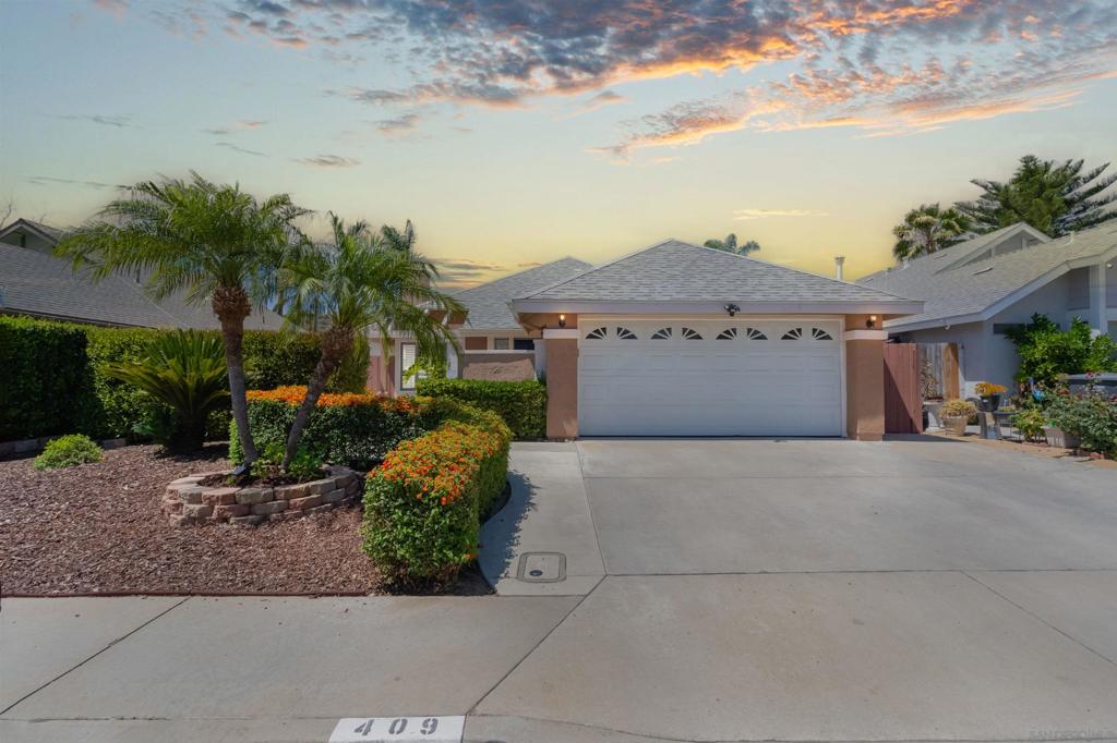 Step into this inviting single-level home nestled in a serene San Marcos neighborhood. Bathed in natural light from numerous windows, the open floor plan emphasizes comfort and effortless flow. Vaulted ceilings, stylish wood flooring, and fresh interior paint create a modern, airy feel throughout. The living area welcomes cozy gatherings with a central fireplace—ideal for relaxing or entertaining. The adjacent kitchen and dining spaces are bright and functional, ready for your personal touch. Spacious rooms offer flexibility for a growing family, guest space, or a home office. Outside, the generous backyard is low maintenance and great for BBQs and gatherings with friends and family. With an attached 2-car garage and in-home laundry hookups, convenience is built in. Located near top-rated schools and in a quiet, established community, this home delivers comfort, style, and everyday ease. Don't miss this charming gem—schedule your tour today!