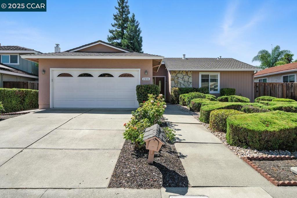 Welcome to a North-facing sparkling gem on Saint Denis Drive in the uber-desirable Montevideo neighborhood! This highly sought-after single-story floor plan offers a coveted layout. The spacious lot showcases meticlously maintained landscaping & an inviting curb appeal. A paved walkway leads to the home's entrance, which opens to a design filled w/abundant natural light. The living room boasts a cozy fireplace & neutral tones, complemented by the home's high vaulted ceilings. The updated kitchen is spacious & features abundant cabinetry, stainless steel appliances, granite countertops, & a built-in pantry. The kitchen opens to the convenient family room, w/slider to the backyard, & also opens to the dining room, making for an excellent flow. The primary bedroom is generously sized & includes dual closets & a beautifully updated en-suite bath.There are two additional bedrooms w/views of the backyard & an updated hall bath. The property features an expansive outdoor area w/a pergola & a lush lawn. There is also a hot tub for your relaxation! The yard also has a parking area w/room for a boat/RV. Fabulously located close to 12 years of award-winning schools, Athan Downs Park, Aquatic Center, trails, freeway, & incredible shopping, dining & entertainment at the popular City Center!