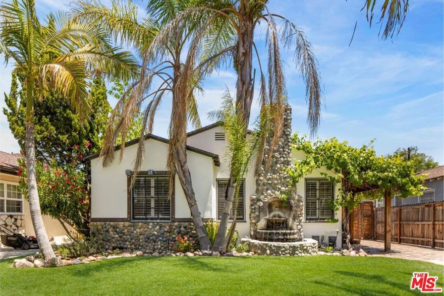 Tucked into the heart of Toluca Woods, this updated traditional home with a pool and guest house is set privately on a tree-lined street. Custom millwork throughout the property adds warmth and a sense of craftsmanship, while sun-filled living spaces offer views into the backyard. The floor plan is smartly configured. The living room, with a fireplace, sits adjacent to the dining room, which connects to the kitchen and a den/flex space. The main house features two bedrooms and two bathrooms. Providing additional space for living or hosting, the detached guest house has been recently updated and is nearly 600 square feet in size. It includes a one-bedroom suite, living area, full bathroom, kitchenette with bar, and updated flooring and cabinetry. The backyard is private and well-suited for both entertaining and quiet evenings, complete with a newly installed outdoor kitchen and fire pit. The pool and spa are surrounded by mature landscaping, including a fruitful lemon tree. All this, just moments from the studios, freeways, farmers markets, and the NoHo Arts District.