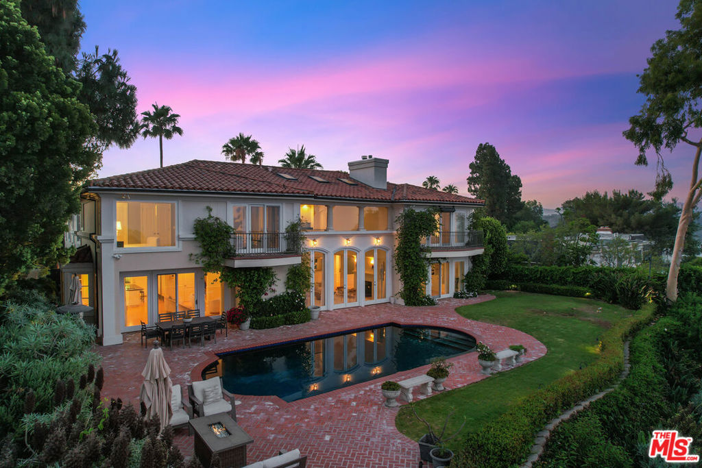 Elevated on a private Bel Air ridge, this fully remodeled Mediterranean estate offers breathtaking panoramic views spanning DTLA, the mountains, and Catalina. The home blends timeless European architecture with modern luxury finishes, featuring dramatic living spaces with soaring ceilings, a two-way fireplace, and walls of glass opening to expansive terraces. The chef's kitchen, elegant formal rooms, and seamless indoor-outdoor flow create an entertainer's dream. Retreat to the primary suite with its own fireplace, spa-inspired bath, and private balcony. Outdoors, enjoy the infinity-edge pool, spa, and generous 13,134 sq. ft. lot designed for privacy and relaxation. With 6 bedrooms, 7.5 baths, and offered fully furnished, this turnkey residence captures the essence of California luxury living. Available now for lease.