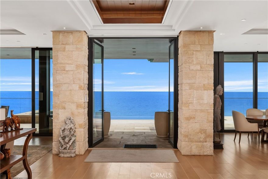 Welcome to a Masterpiece of Coastal Elegance in the Prestigious Strand at Headlands, Dana Point designed by the renowned architect C.J. Light. Perched majestically above the golden sands and glistening waters of Southern California’s most coveted shoreline, this extraordinary oceanfront estate is the pinnacle of luxury coastal living. Located within the exclusive guard-gated enclave of The Strand, this architectural triumph offers a breathtaking fusion of contemporary sophistication and timeless seaside beauty. Spanning 6,596 square feet of meticulously crafted living space, this residence is a true sanctuary of refinement and tranquility. Featuring four opulent en-suite bedrooms on the upper level — including two lavish master retreats with panoramic ocean vistas, spa-inspired baths, and bespoke walk-in closets — the home is designed to indulge the senses. A versatile office or fifth bedroom with full bath graces the main level, along with a powder room tailored for guest convenience.The heart of the home is a grand open-concept living space where walls of glass invite in sweeping views of the Pacific Ocean and bathe the interiors in natural light. The chef’s kitchen is a culinary dream, adorned with top-tier appliances, custom cabinetry, and dual oversized islands ideal for both intimate gatherings and grand-scale entertaining. Seamlessly connected to elegant living and dining areas, the space flows effortlessly onto expansive outdoor terraces, blurring the line between indoor and outdoor living. Step into your private coastal haven — a meticulously landscaped backyard oasis featuring a shimmering pool and spa, multiple lounging and dining areas, and unobstructed sunset views of the Pacific Ocean. Set on a rare 10,934 square foot lot, this estate also includes a spacious three-car garage, offering ample room for vehicles. As a resident of The Strand, you will enjoy access to world-class community amenities including a private beach club, fitness center, and coastal trails — all in a setting defined by elegance, privacy, and prestige. This is not merely a home. It is a lifestyle. A statement. A rare opportunity to claim one of Southern California’s most exclusive addresses. Welcome to your coastal sanctuary — where the sea meets serenity in grand, unforgettable fashion.